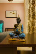Regal Serenity Buddha Idol – Blue & Gold Meditation Statue